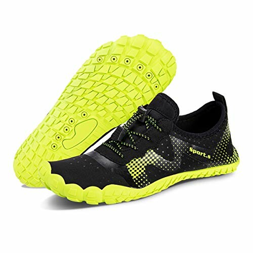 Black and yellow sports shoes with textured sole.